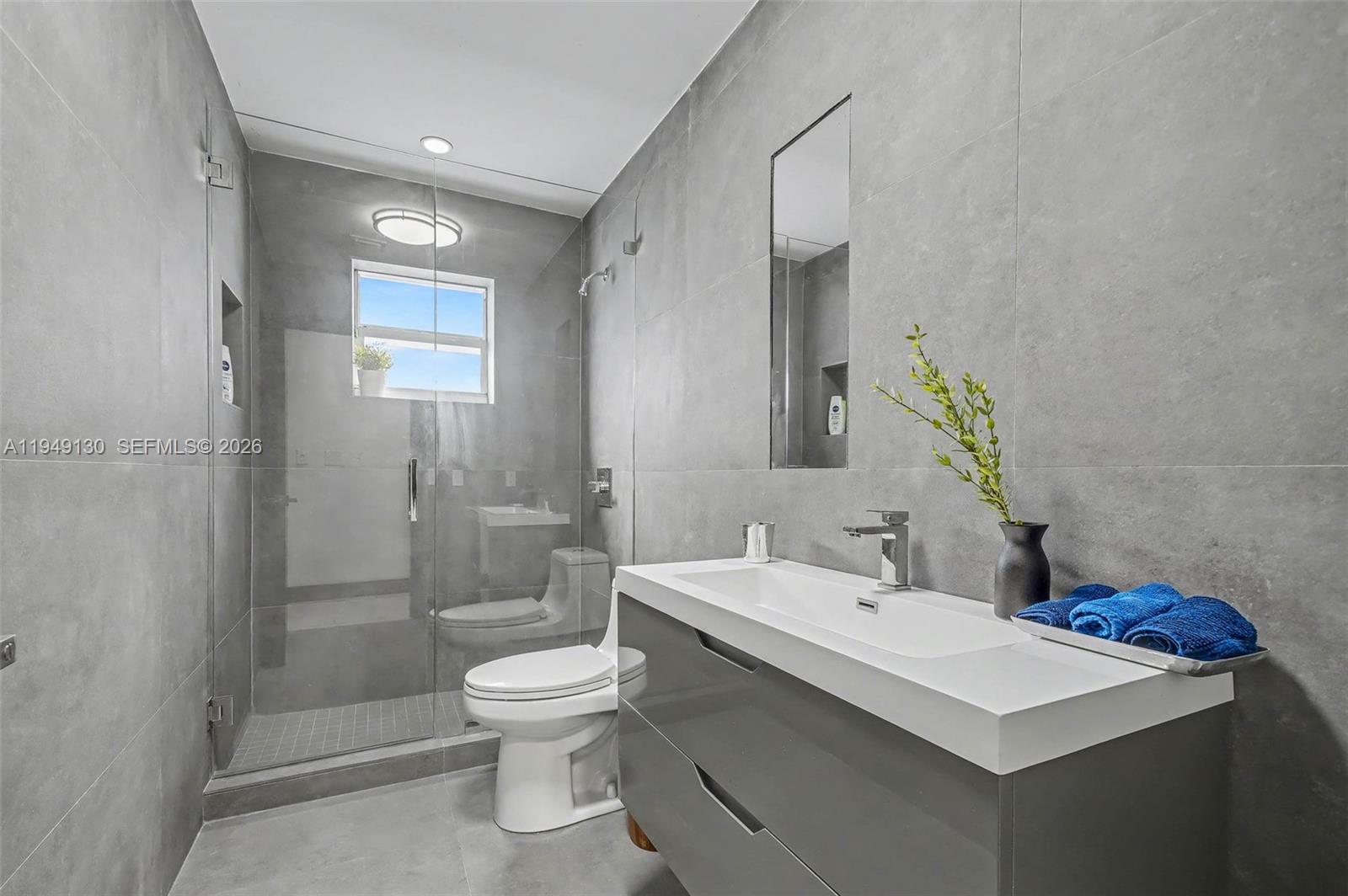 3097 Southwest 132nd Place Miami, FL 33175 - Photo 16 of 26 a bathroom with a sink toilet and shower