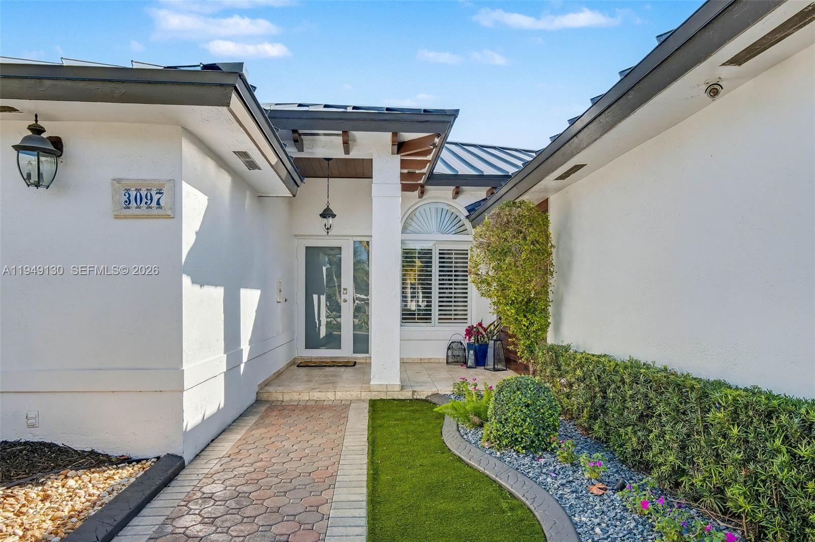 3097 Southwest 132nd Place Miami, FL 33175 - Photo 3 of 26 a front view of a house with a yard