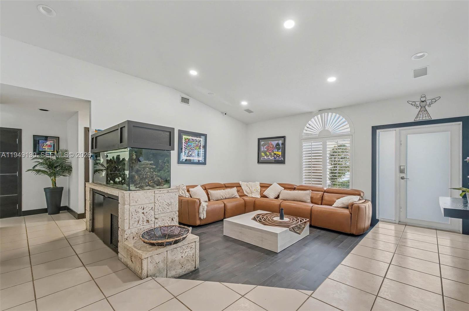 3097 Southwest 132nd Place Miami, FL 33175 - Photo 5 of 26 a living room with furniture and a flat screen tv