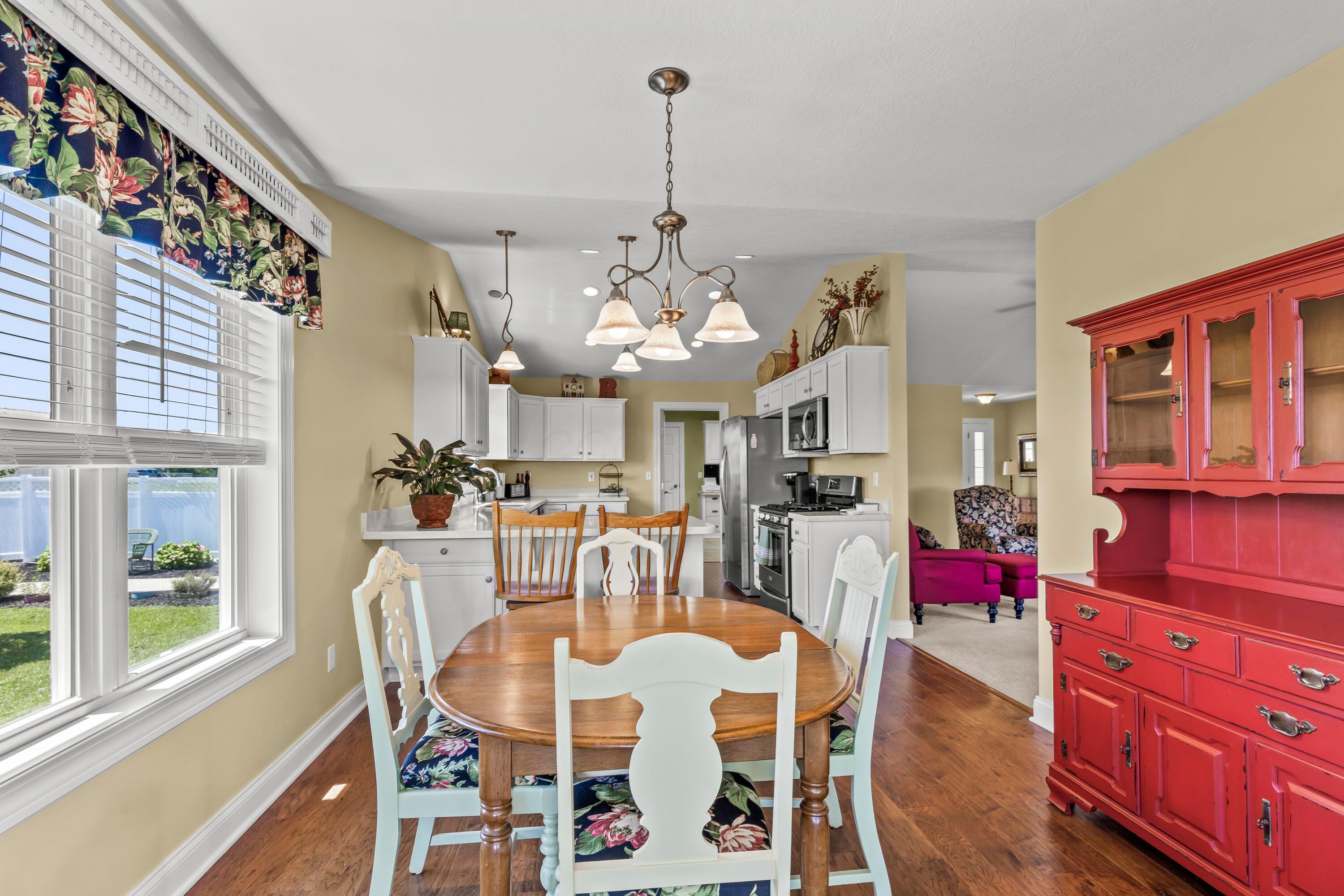 3582 Panhandle Road Delaware, OH 43015 - Photo 30 of 65 • New englewood flooring ~ 2015 • Ivory painted walls • Chandelier • 2” blinds • Sliding doors to screened porch