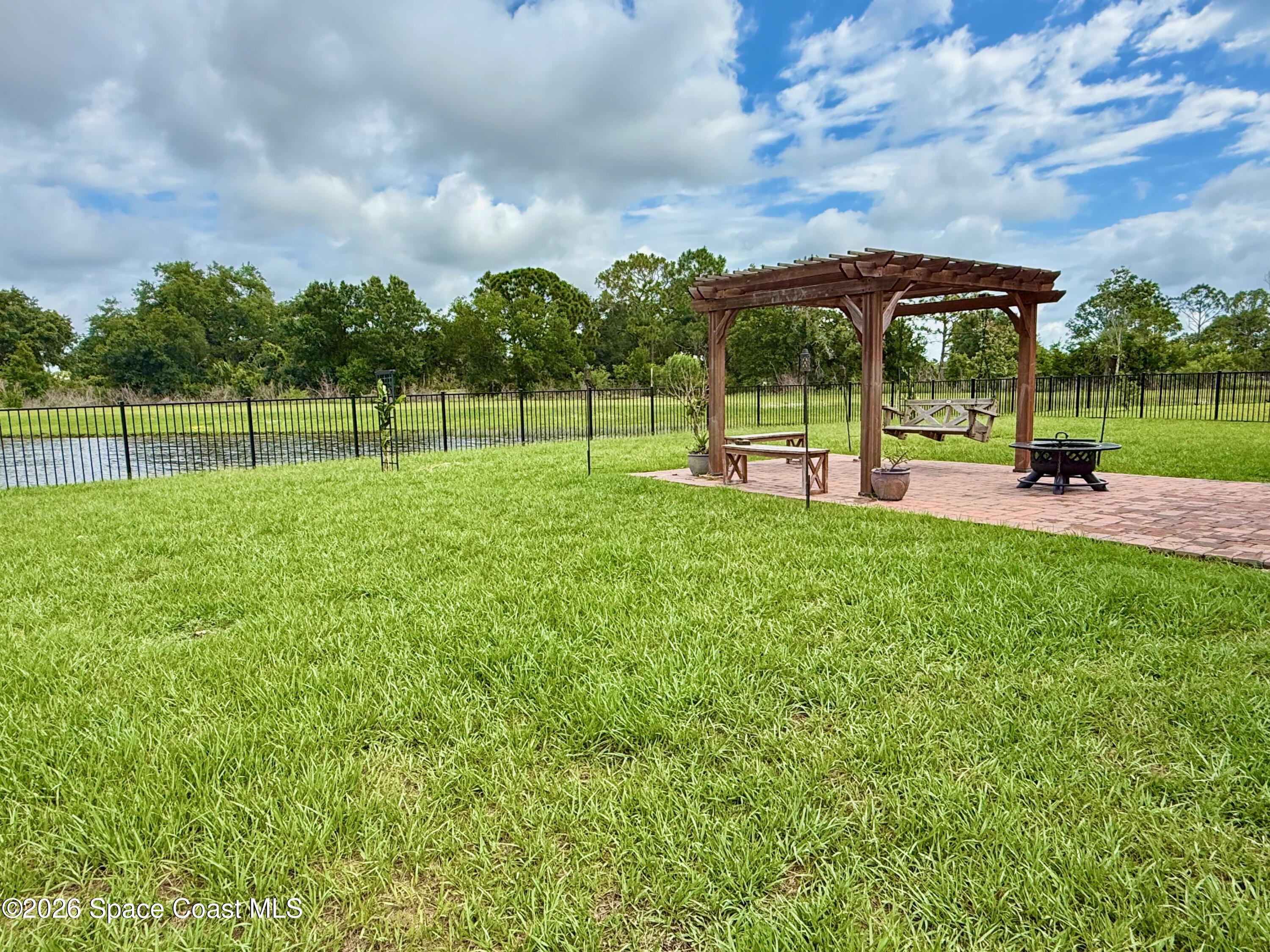 1873 Farmhouse Road Southeast Palm Bay, FL 32909 - Photo 4 of 35 Huge fenced yard overlooking water