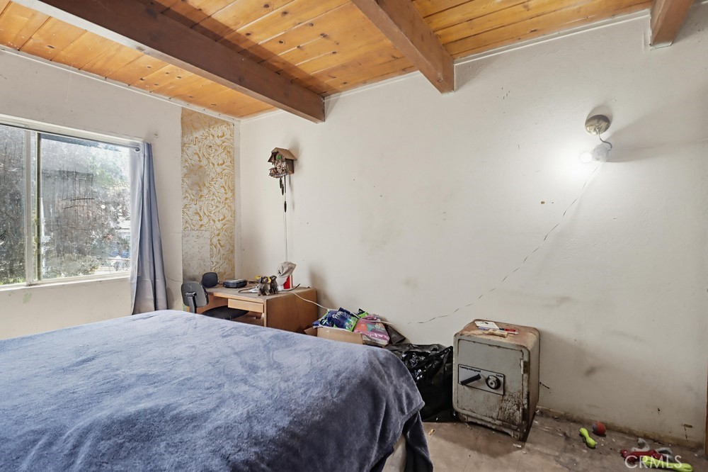 736 Sacramento Avenue Spring Valley, CA 91977 - Photo 14 of 33 a bedroom with a bed and a window