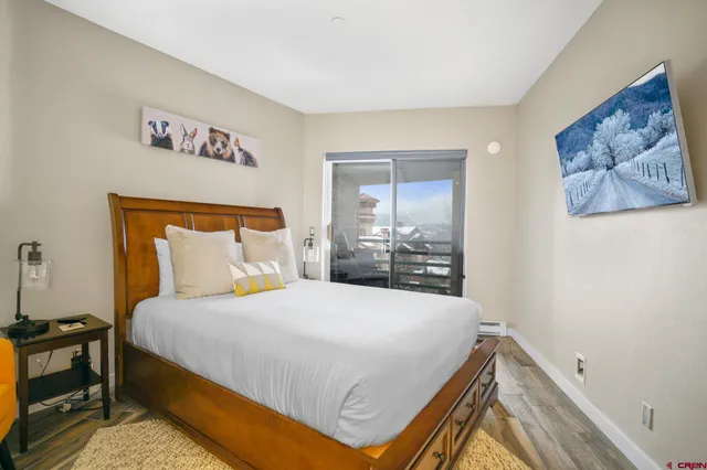 a bedroom with a bed and dresser