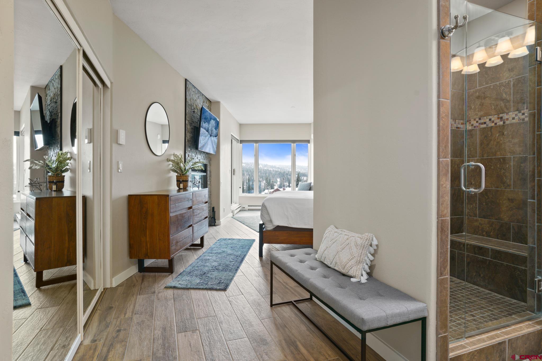 117 Needles Way, Unit 521 Durango, CO 81301 - Photo 13 of 19 a living room with furniture and a wooden floor