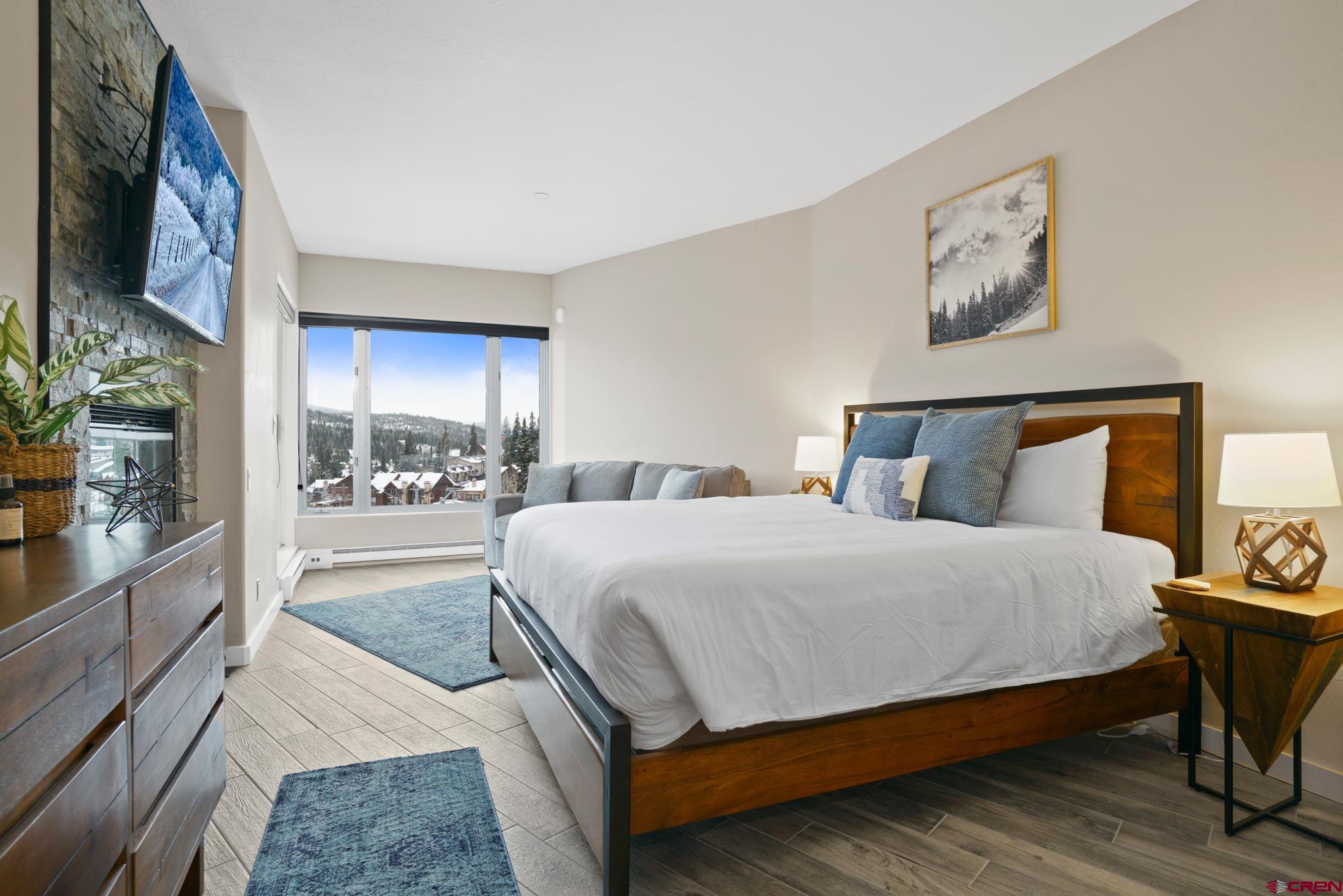 117 Needles Way, Unit 521 Durango, CO 81301 - Photo 14 of 19 a bedroom with a large bed and a balcony