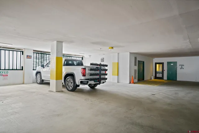 a view of a livingroom with furniture and a garage