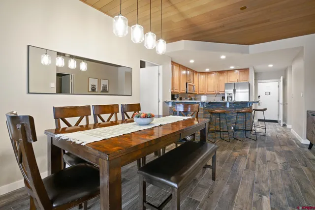 a large kitchen with a table and chairs