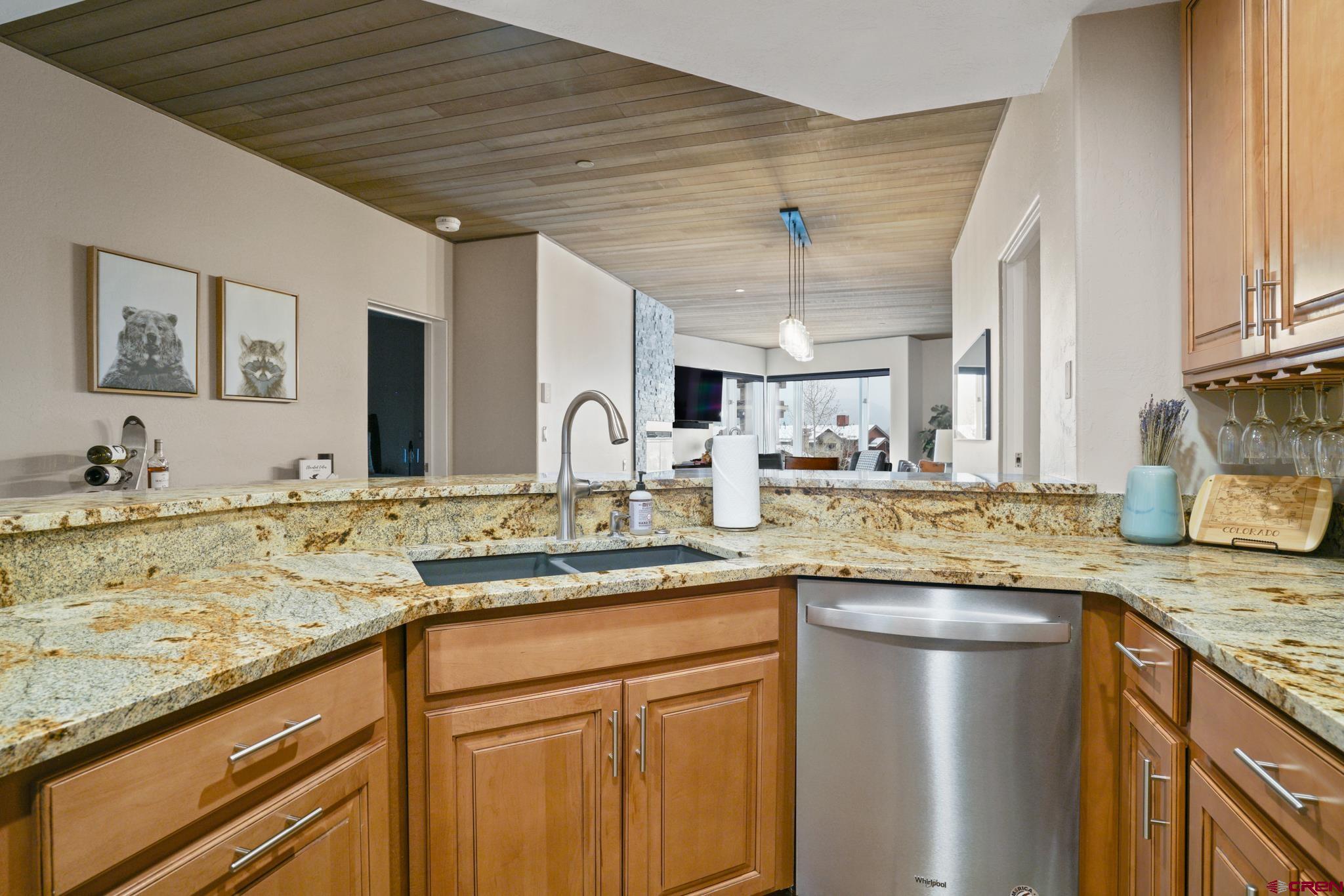 117 Needles Way, Unit 521 Durango, CO 81301 - Photo 6 of 19 a kitchen with stainless steel appliances granite countertop a sink and cabinets