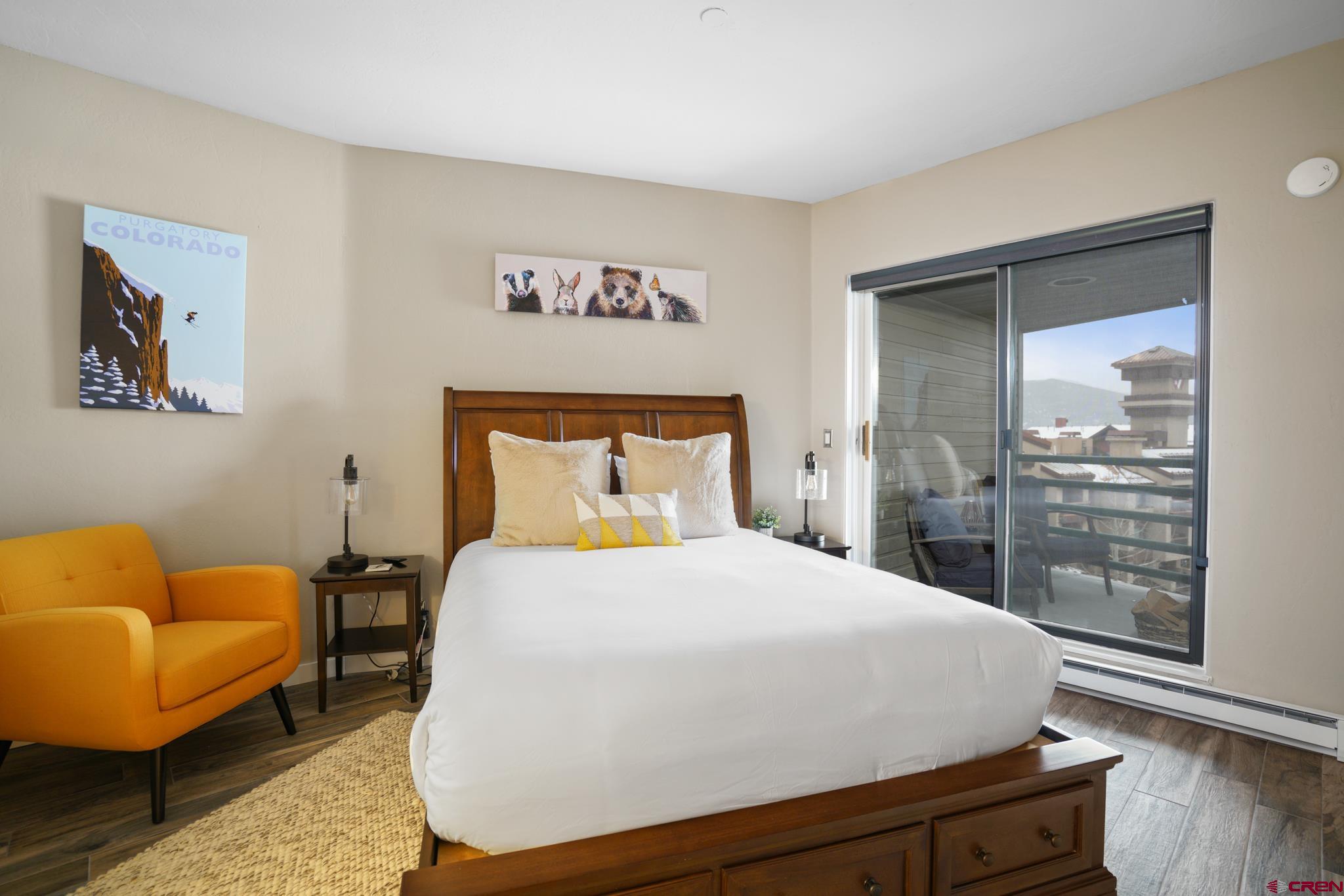 117 Needles Way, Unit 521 Durango, CO 81301 - Photo 10 of 19 a bedroom with a bed and glass window