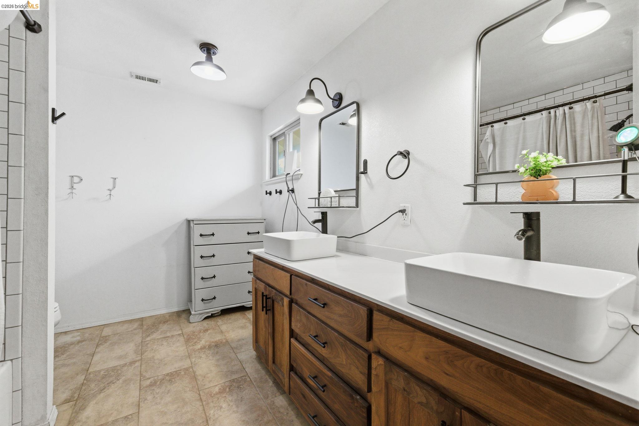 16860 Buckhorn Mountain Road Sonora, CA 95370 - Photo 12 of 46 Bathroom featuring a shower with curtain and double vanity