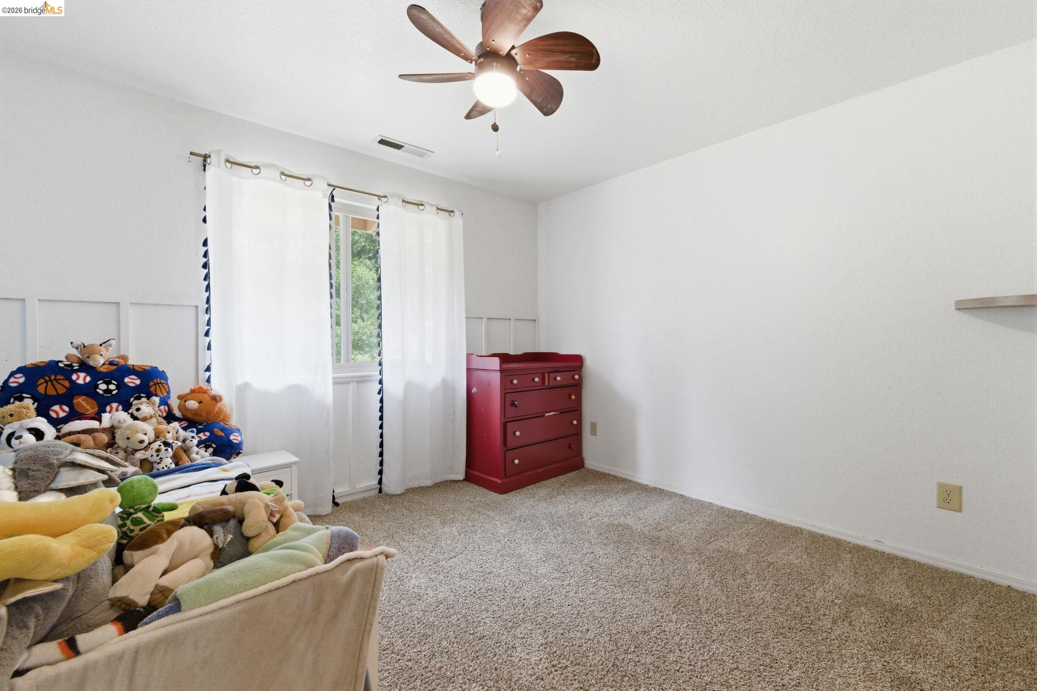 16860 Buckhorn Mountain Road Sonora, CA 95370 - Photo 13 of 46 Bedroom featuring light colored carpet and ceiling fan