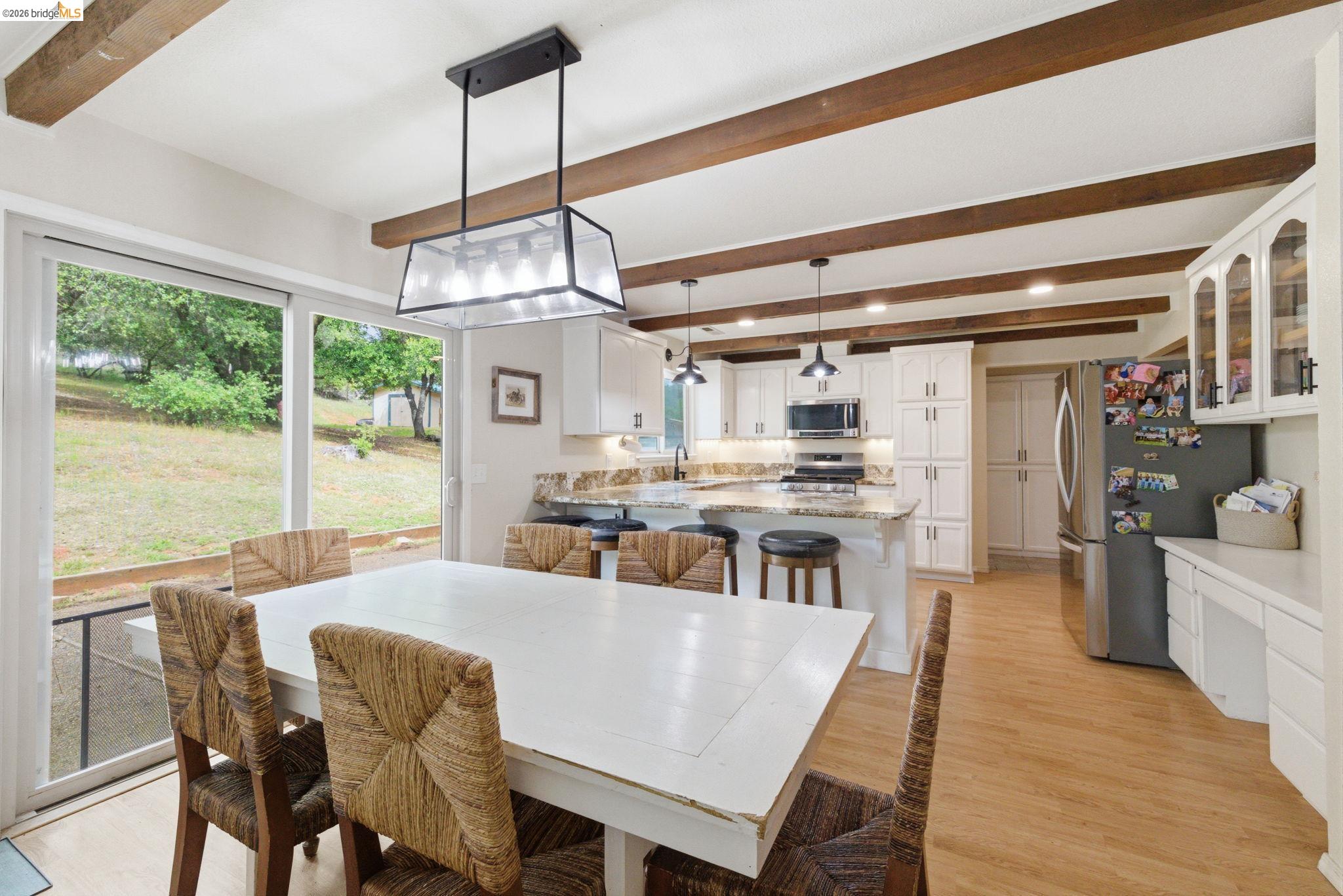 16860 Buckhorn Mountain Road Sonora, CA 95370 - Photo 28 of 46 Dining area featuring beamed ceiling and light wood-style floors