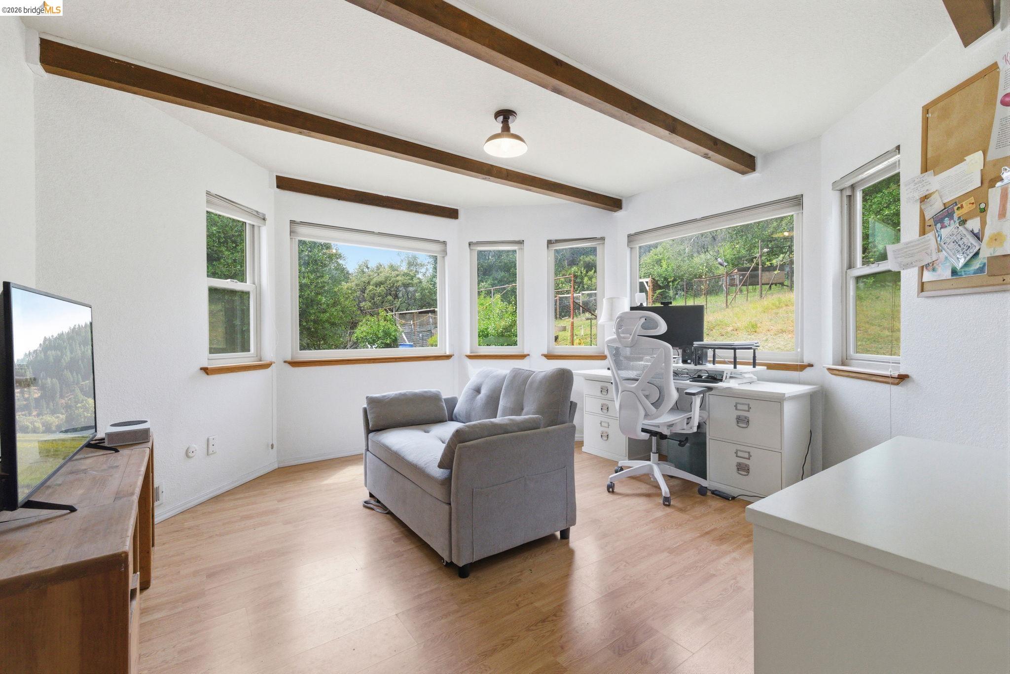 16860 Buckhorn Mountain Road Sonora, CA 95370 - Photo 33 of 46 Office area with light wood finished floors, plenty of natural light, and beam ceiling
