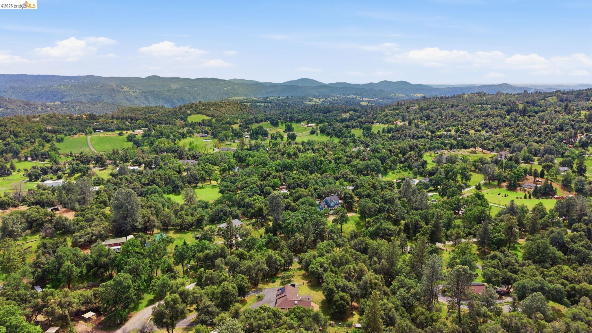 16860 Buckhorn Mountain Road Sonora, CA 95370 - Photo 40 of 46 Drone / aerial view of a mountainous background and a forest