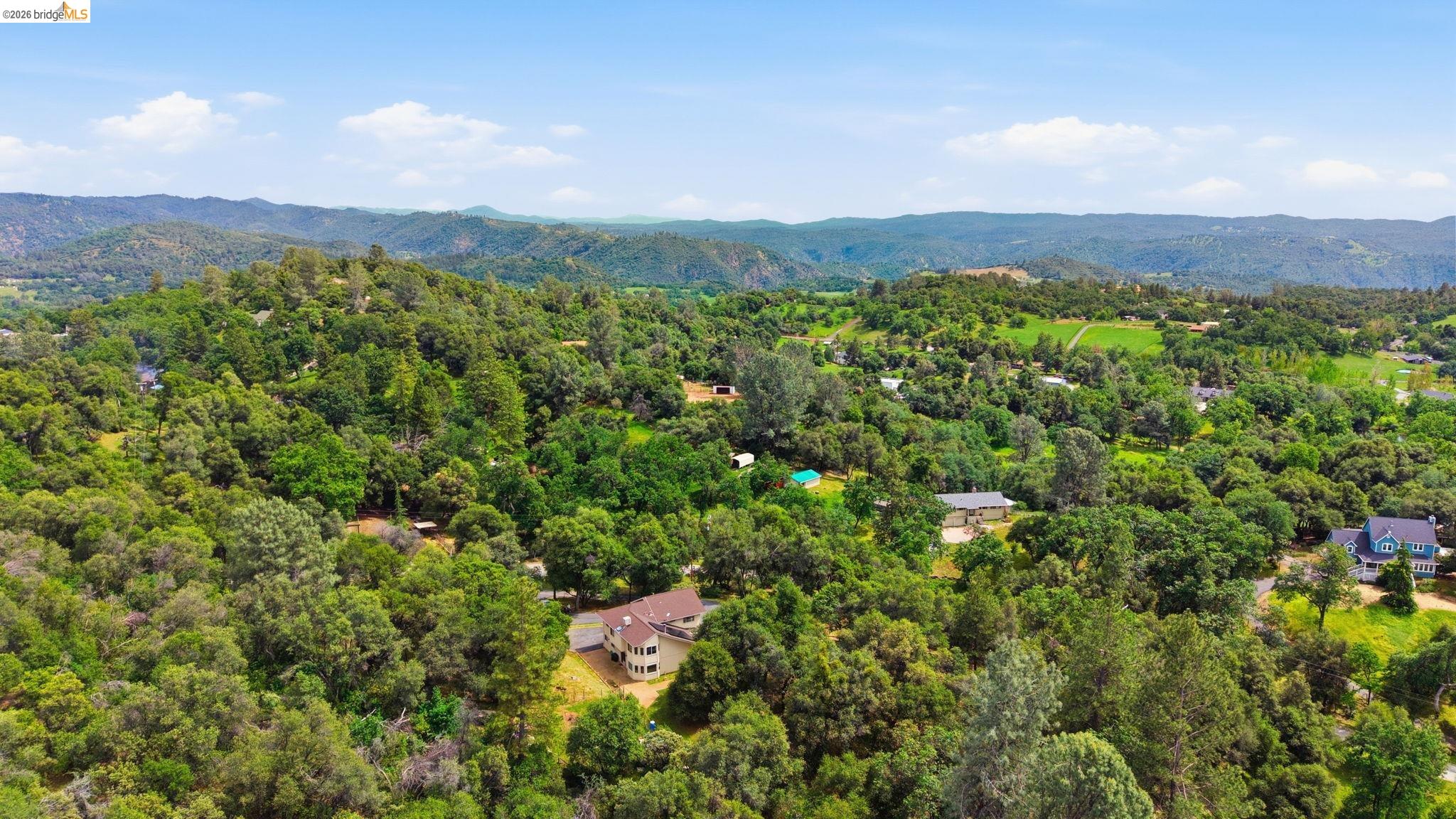 16860 Buckhorn Mountain Road Sonora, CA 95370 - Photo 41 of 46 Aerial view of a forest and mountains