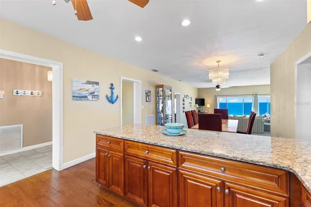 a view of living room with granite countertop furniture and wooden floor