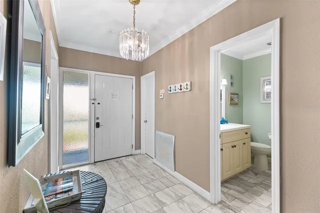 a spacious en suite bathroom with a granite countertop sink a mirror and a shower