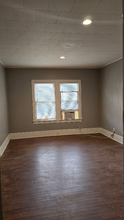 18327 Blake Manor Road Manor, TX 78653 - Photo 12 of 21 a view of an empty room with wooden floor and a window
