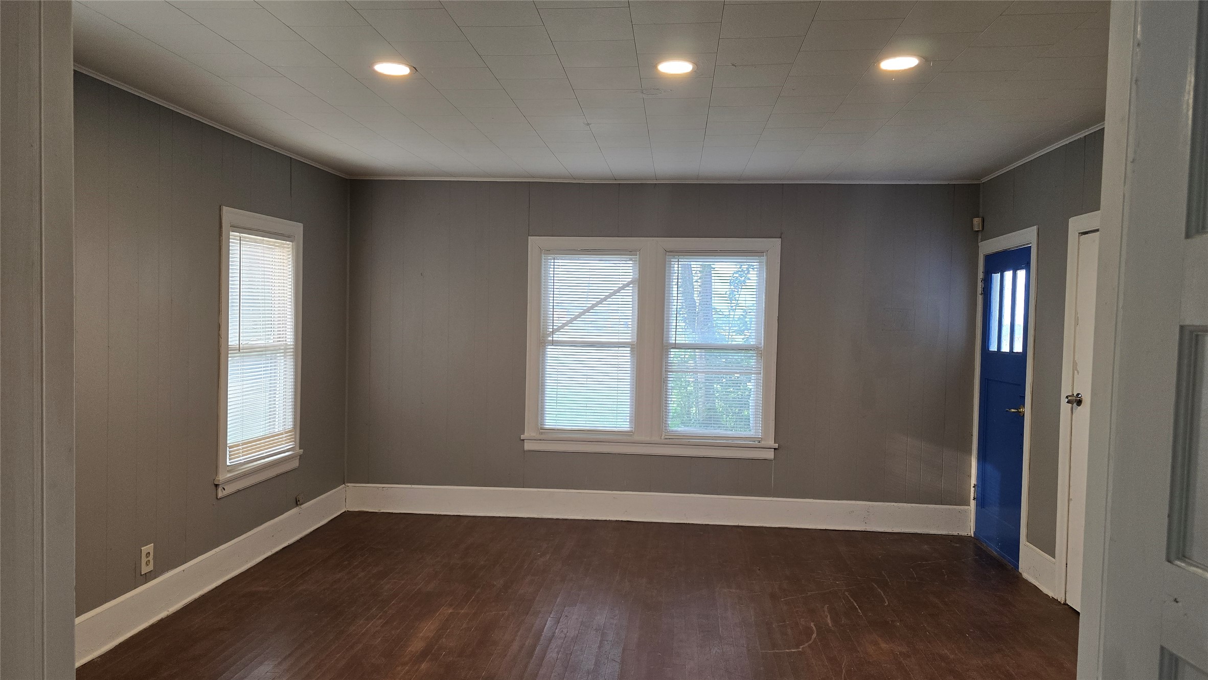 18327 Blake Manor Road, Unit A Manor, TX 78653 - Photo 10 of 21 Empty room with recessed lighting, dark wood-style floors, and plenty of natural light