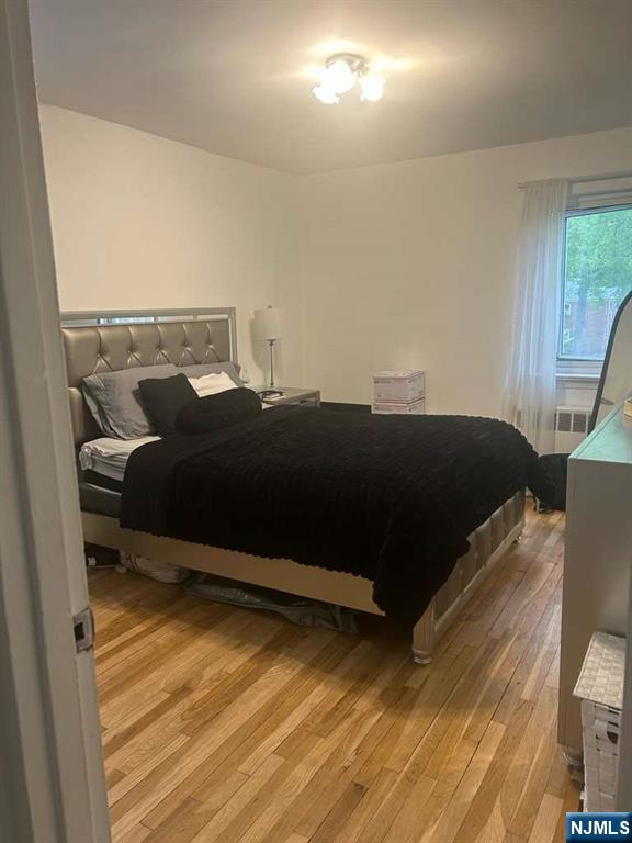 1480 Terrace, Unit 4 Teaneck, NJ 07666 - Photo 7 of 14 a bedroom with a bed and window