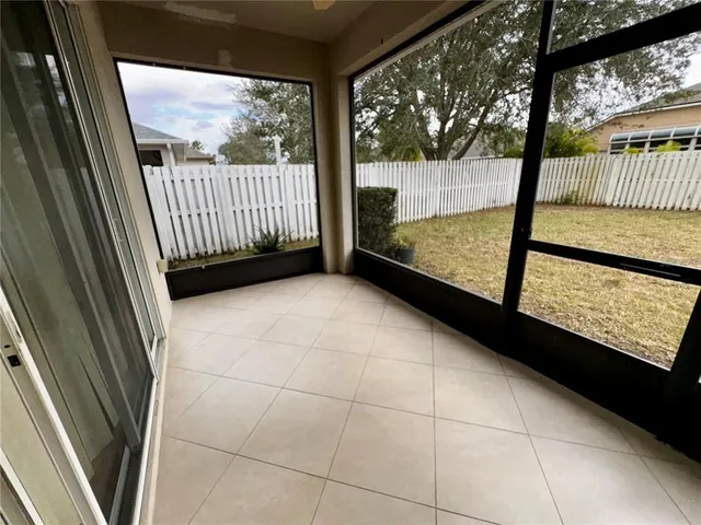 a view of two chairs in the balcony