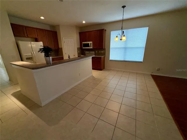 a view of a kitchen with a sink