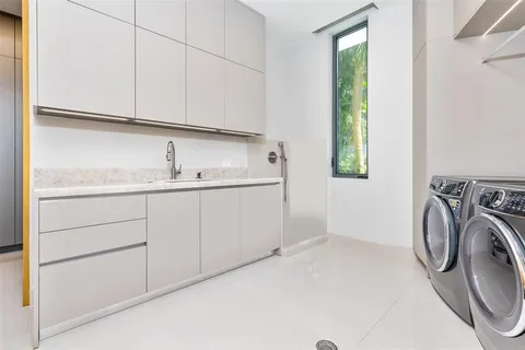 a bathroom with a toilet a sink and a mirror