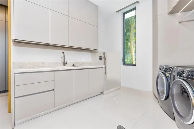 a bathroom with a toilet a sink and a mirror