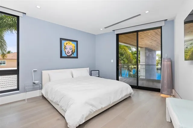 a view of a lake with couches chairs