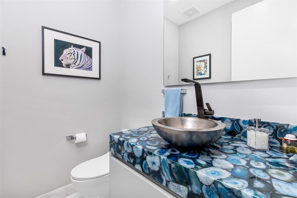 34 Minnetonka Road Sea Ranch Lakes, FL 33308 - Photo 40 of 89 a bathroom with a toilet a sink and a mirror