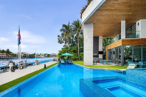 a view of a swimming pool with lounge chairs