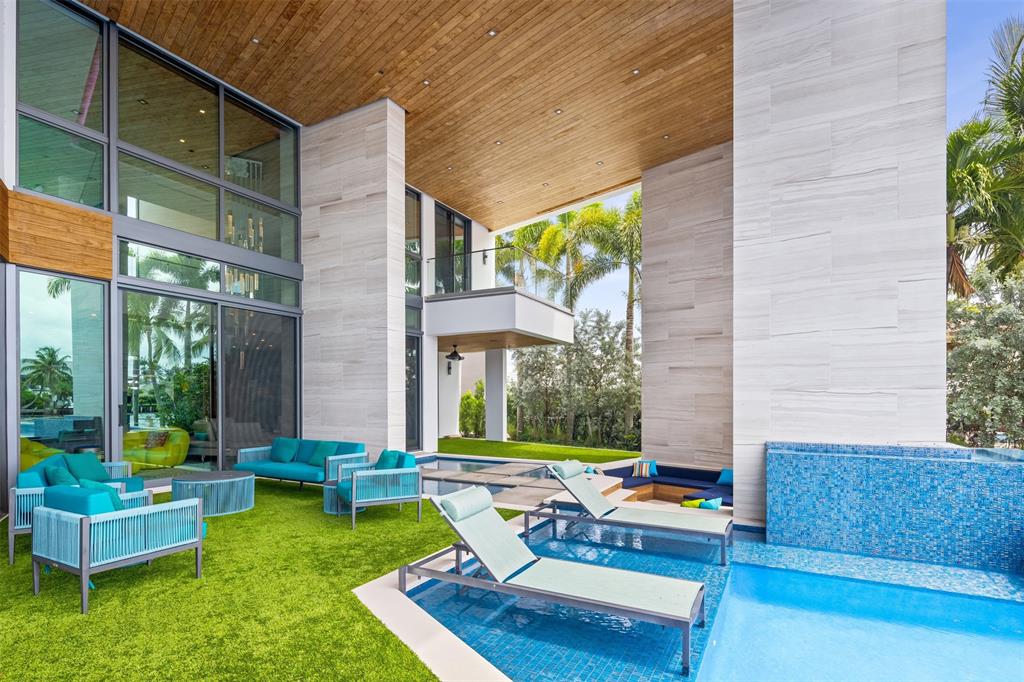 34 Minnetonka Road Sea Ranch Lakes, FL 33308 - Photo 62 of 89 a swimming pool with outdoor seating and yard