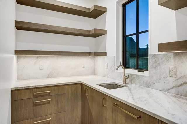a kitchen with a sink and a window