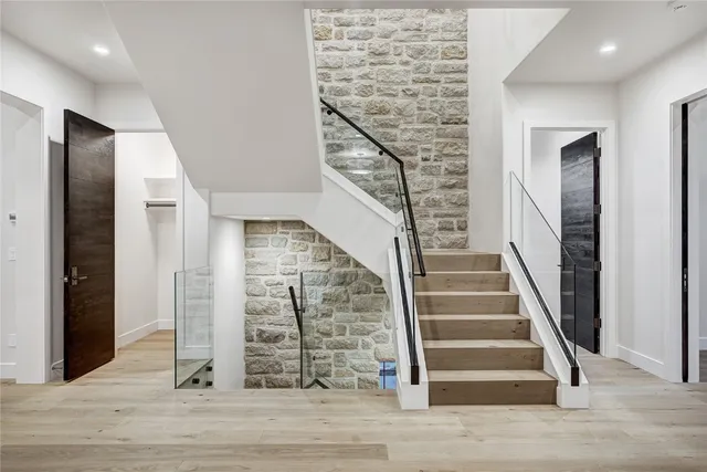 a view of entryway with wooden floor and stairs