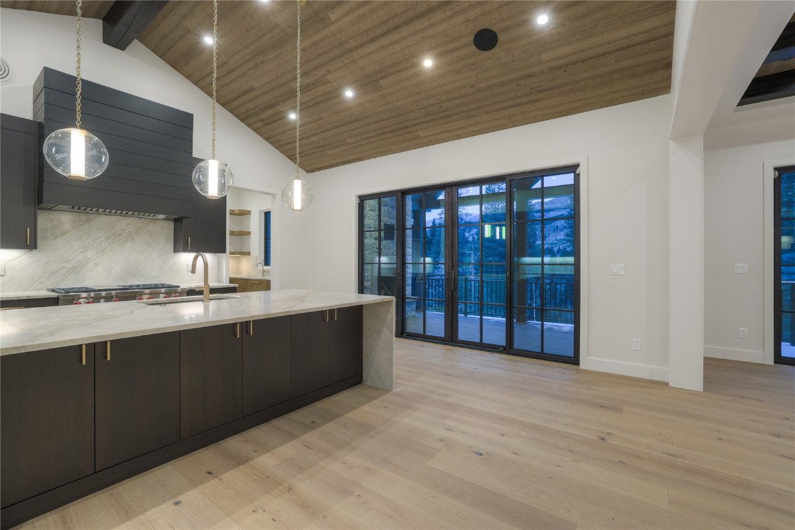 90 West Trade Court Keystone, CO 80435 - Photo 20 of 50 a large kitchen with stainless steel appliances granite countertop a sink and cabinets