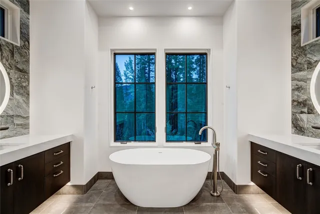 a spacious bathroom with a bathtub and sink