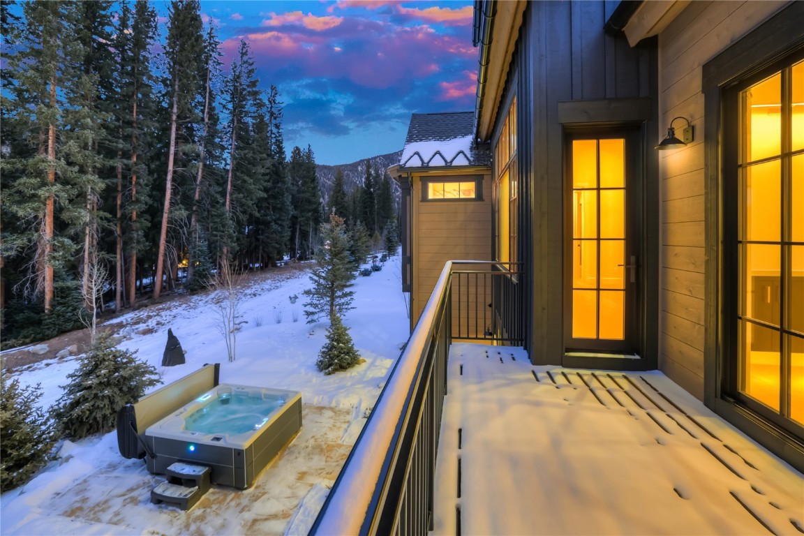 90 West Trade Court Keystone, CO 80435 - Photo 25 of 50 Snow covered patio with a hot tub and a balcony