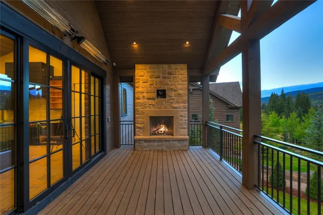 a view of a balcony with wooden floor