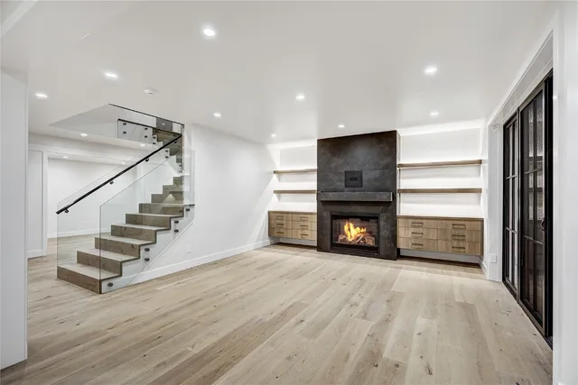 a view of a room with wooden floor and stairs