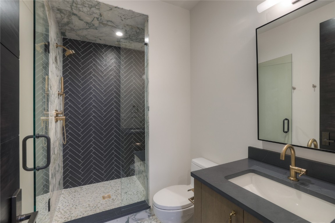 90 West Trade Court Keystone, CO 80435 - Photo 32 of 50 a bathroom with a sink a toilet and shower