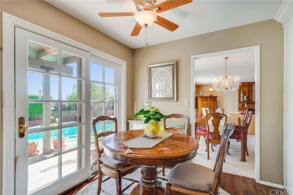3750 Valley Lights Drive Pasadena, CA 91107 - Photo 19 of 55 a view of a dining room with furniture window and wooden floor