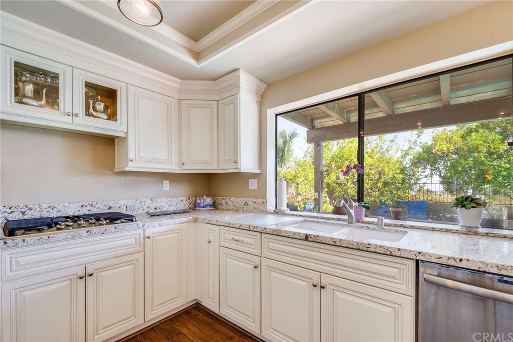 3750 Valley Lights Drive Pasadena, CA 91107 - Photo 22 of 55 a kitchen with granite countertop a sink and white cabinets