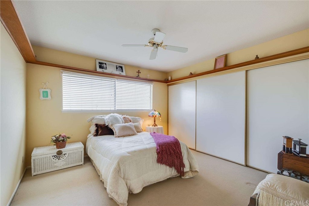 3750 Valley Lights Drive Pasadena, CA 91107 - Photo 32 of 55 a bedroom with a bed and a dresser with the shoe rack