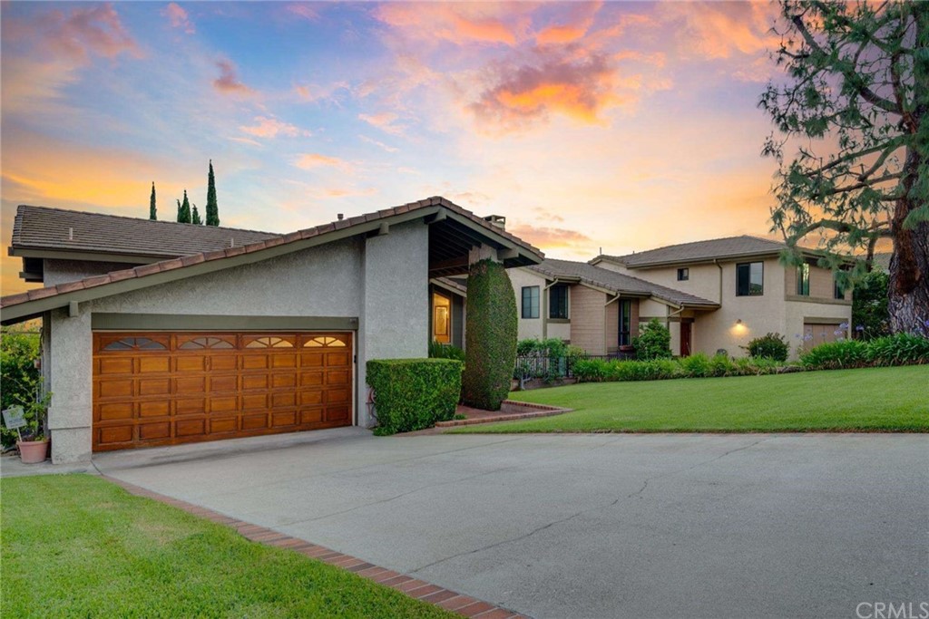 3750 Valley Lights Drive Pasadena, CA 91107 - Photo 4 of 55 a front view of a house with a garden and garage