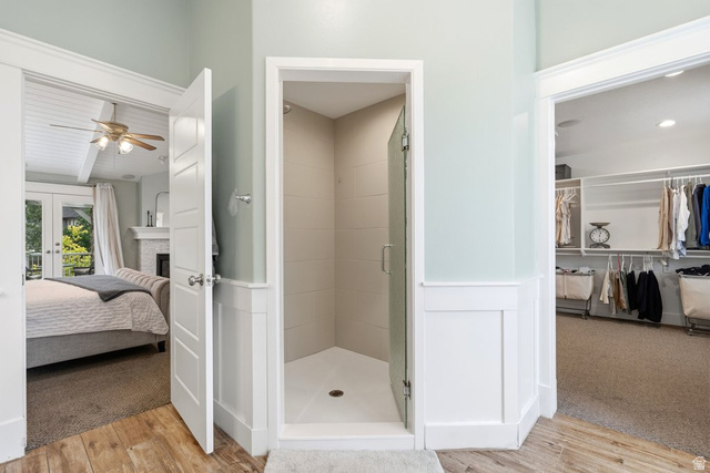 672 Perry Hollow Drive Mapleton, UT 84664 - Photo 51 of 106 Walk-in shower with clear glass enclosure and light-toned tile surround