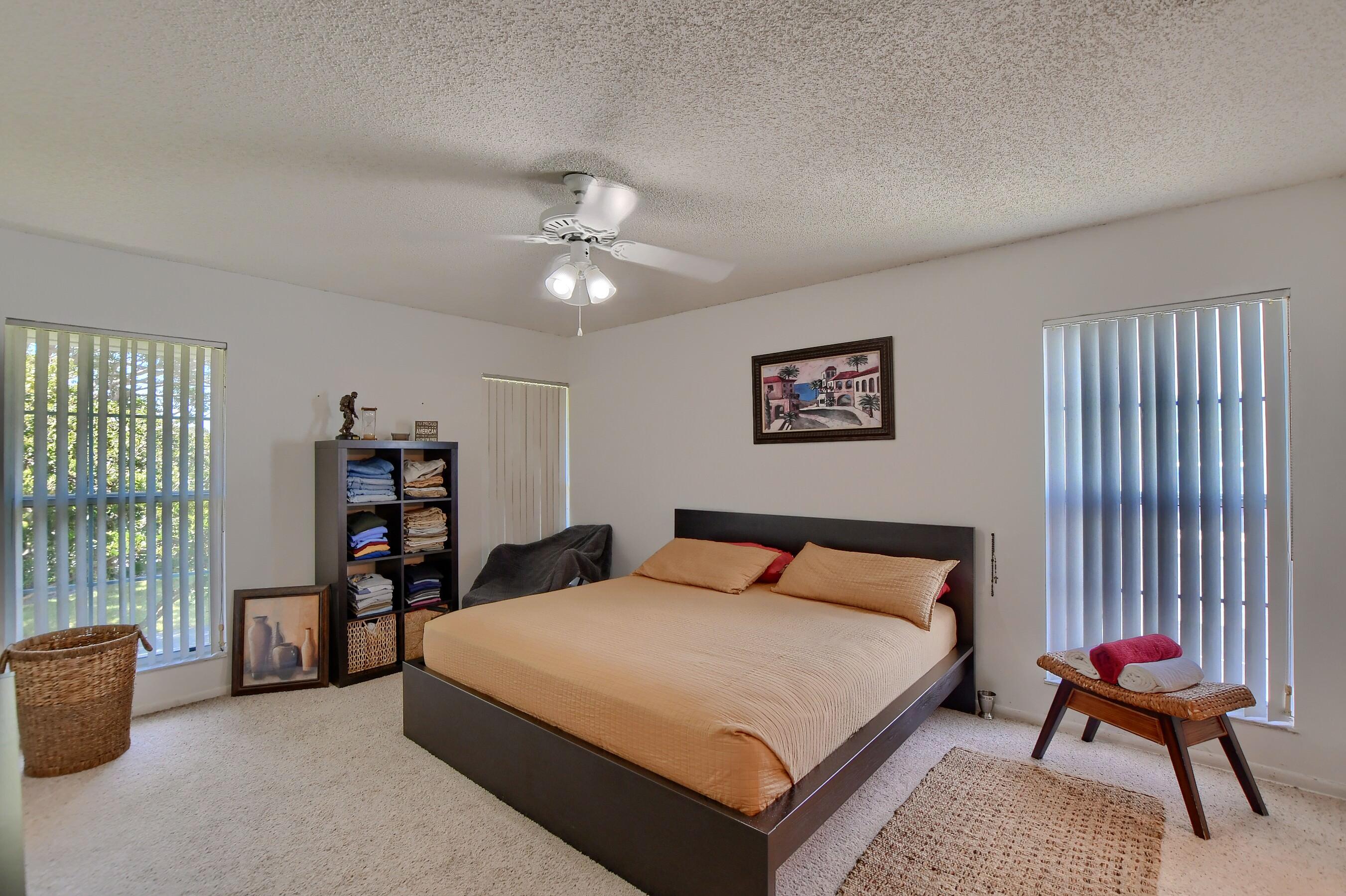 6237 Old Court Road, Unit 203 Boca Raton, FL 33433 - Photo 13 of 34 a bedroom with a bed furniture and a large window