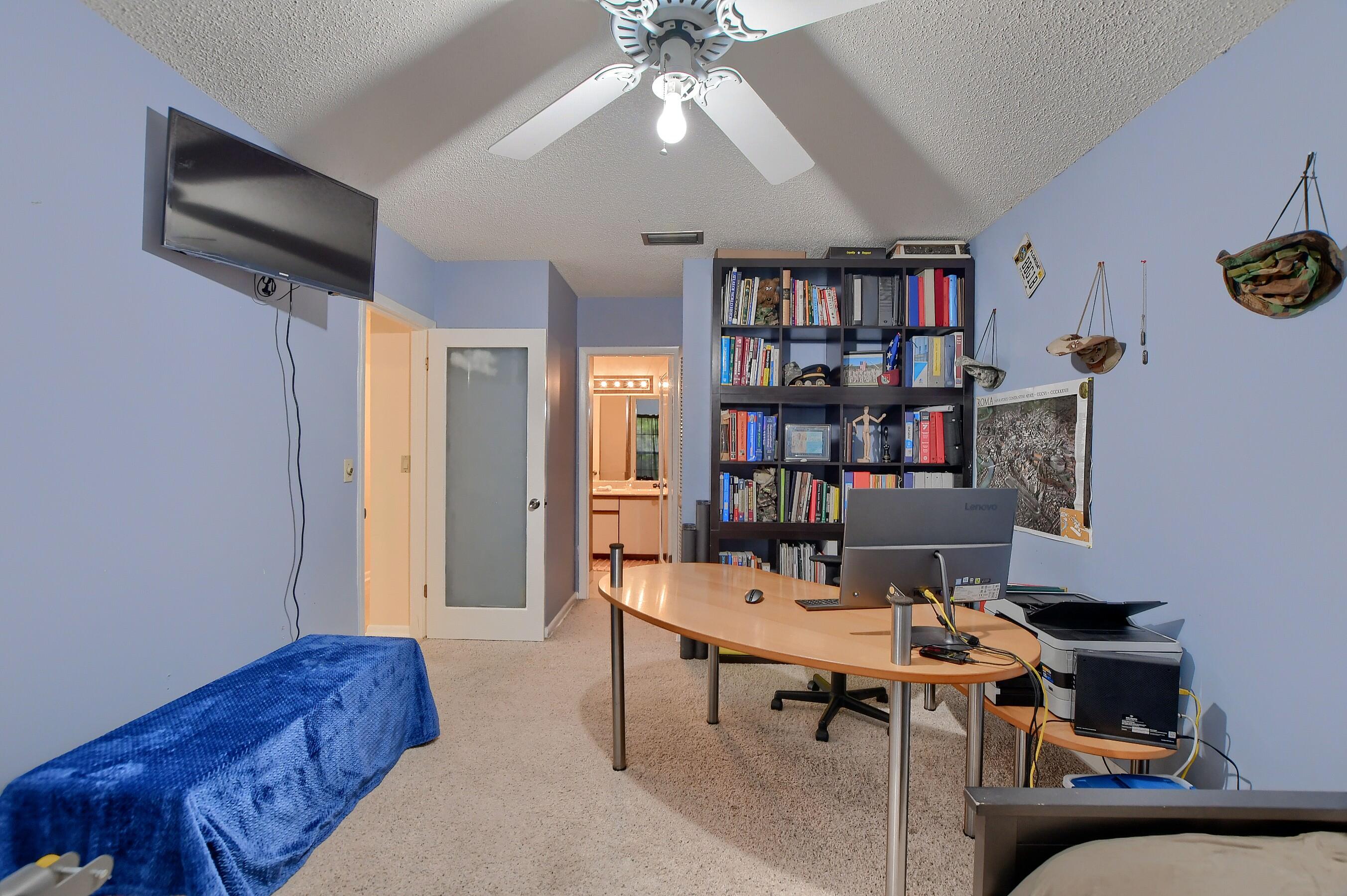 6237 Old Court Road, Unit 203 Boca Raton, FL 33433 - Photo 19 of 34 a living room with furniture and a bookshelf
