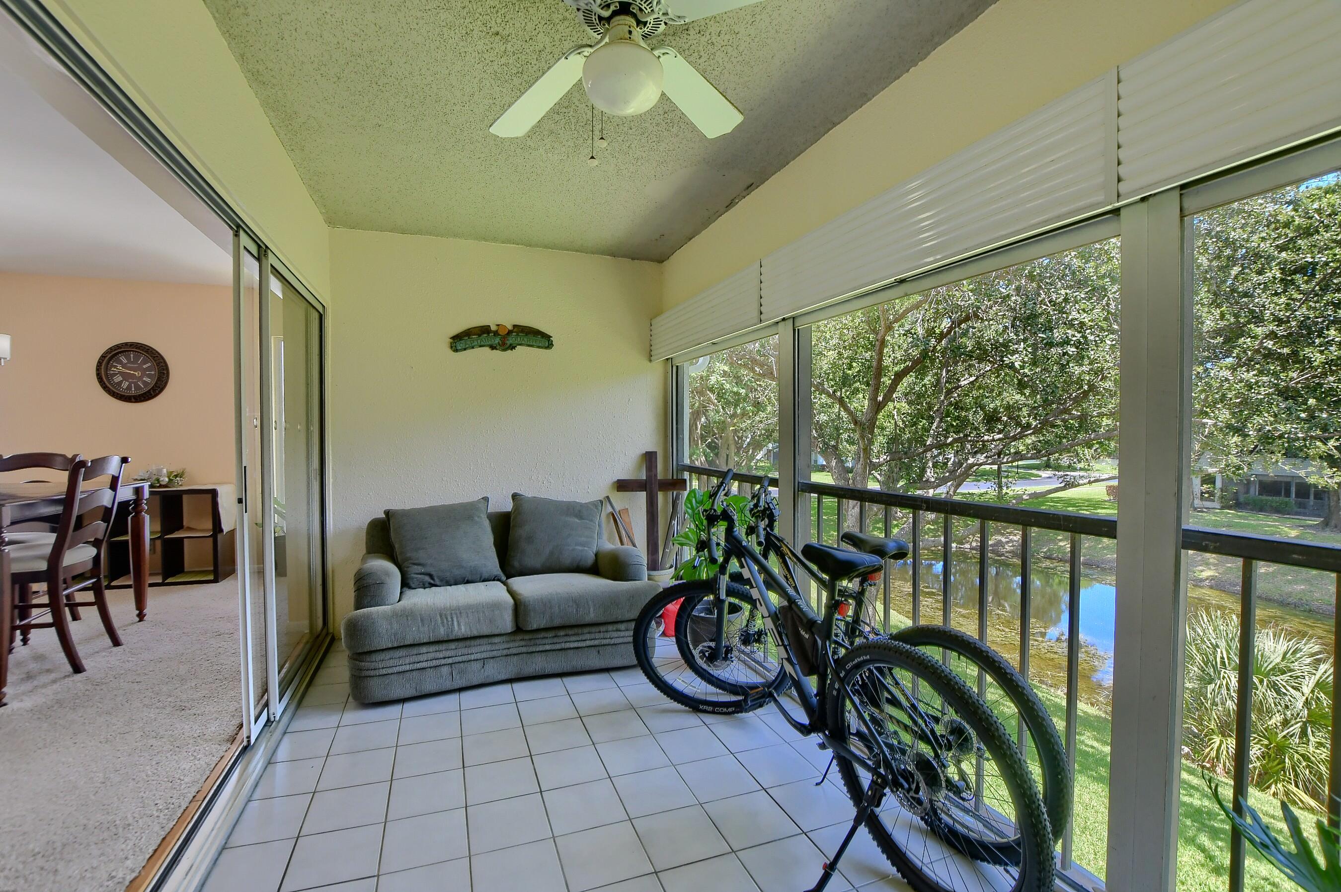 6237 Old Court Road, Unit 203 Boca Raton, FL 33433 - Photo 23 of 34 a living room with furniture and a large window