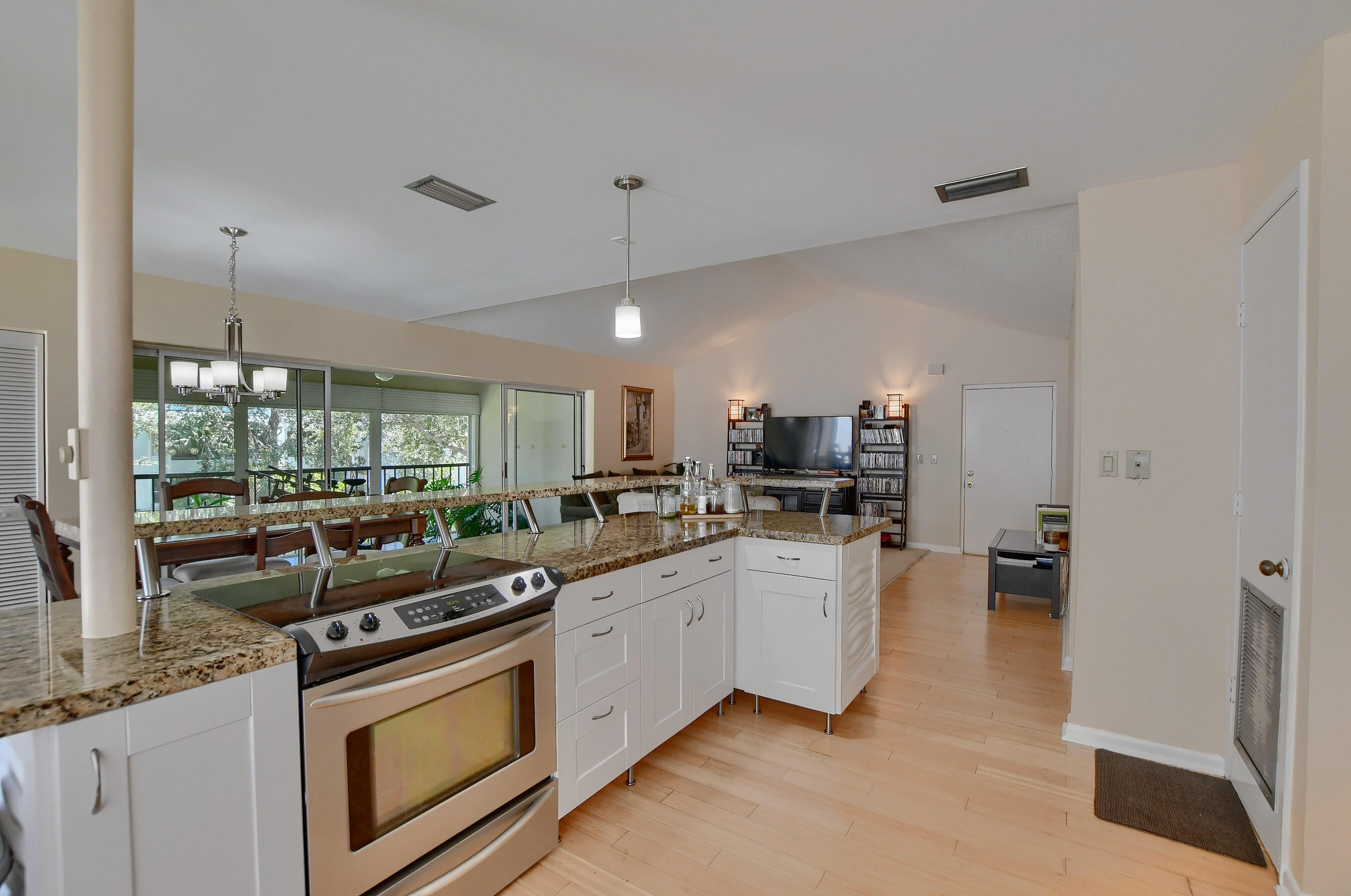 6237 Old Court Road, Unit 203 Boca Raton, FL 33433 - Photo 10 of 34 a kitchen with stainless steel appliances a sink stove and cabinets