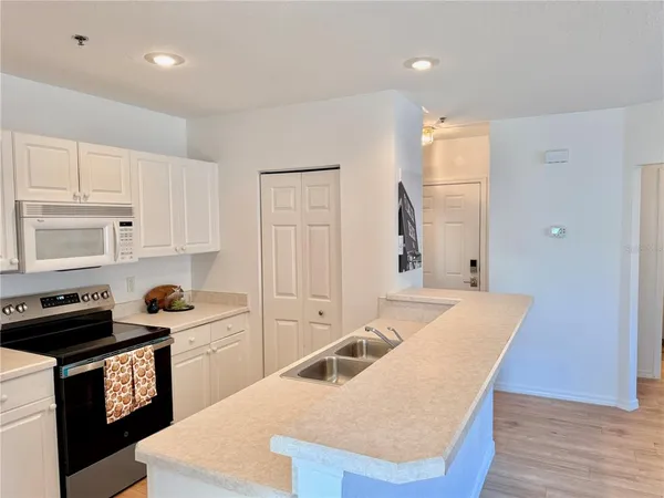 a kitchen that has a sink and a stove